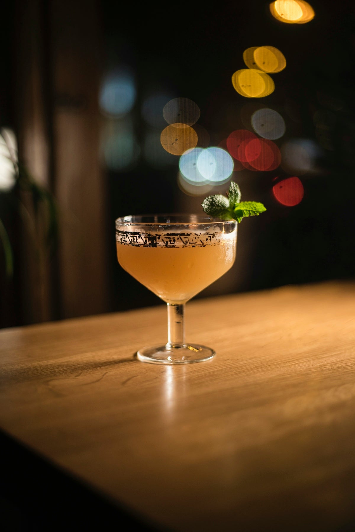 clear cocktail glass on brown wooden table