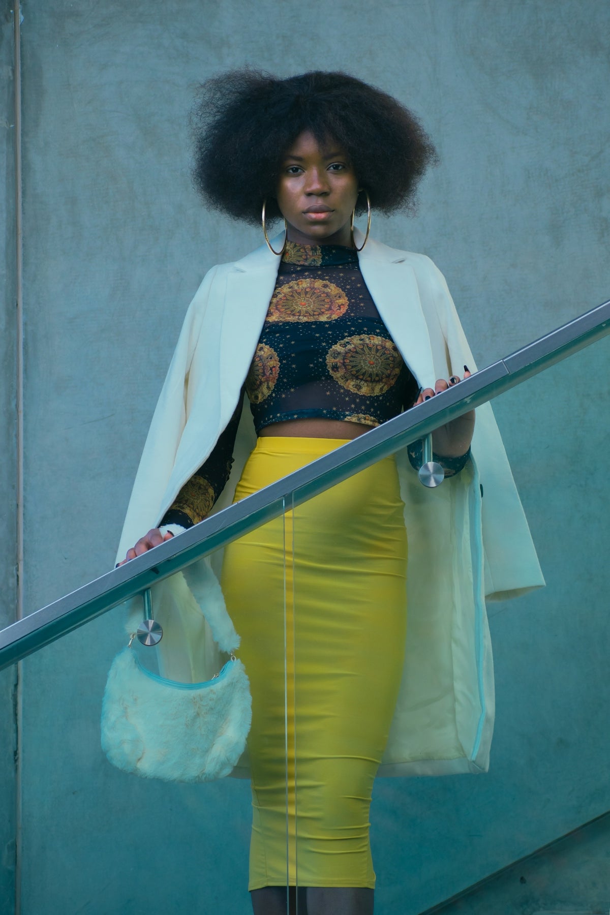 a woman in a yellow skirt and jacket
