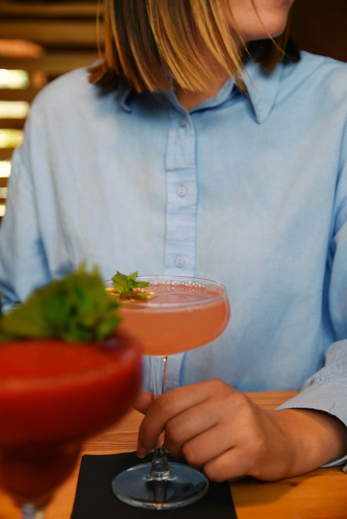 a person holding a glass of wine