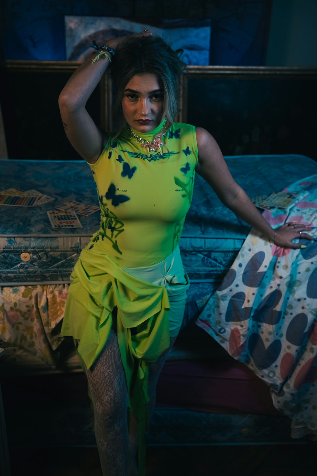 A woman in a yellow dress sitting on a couch